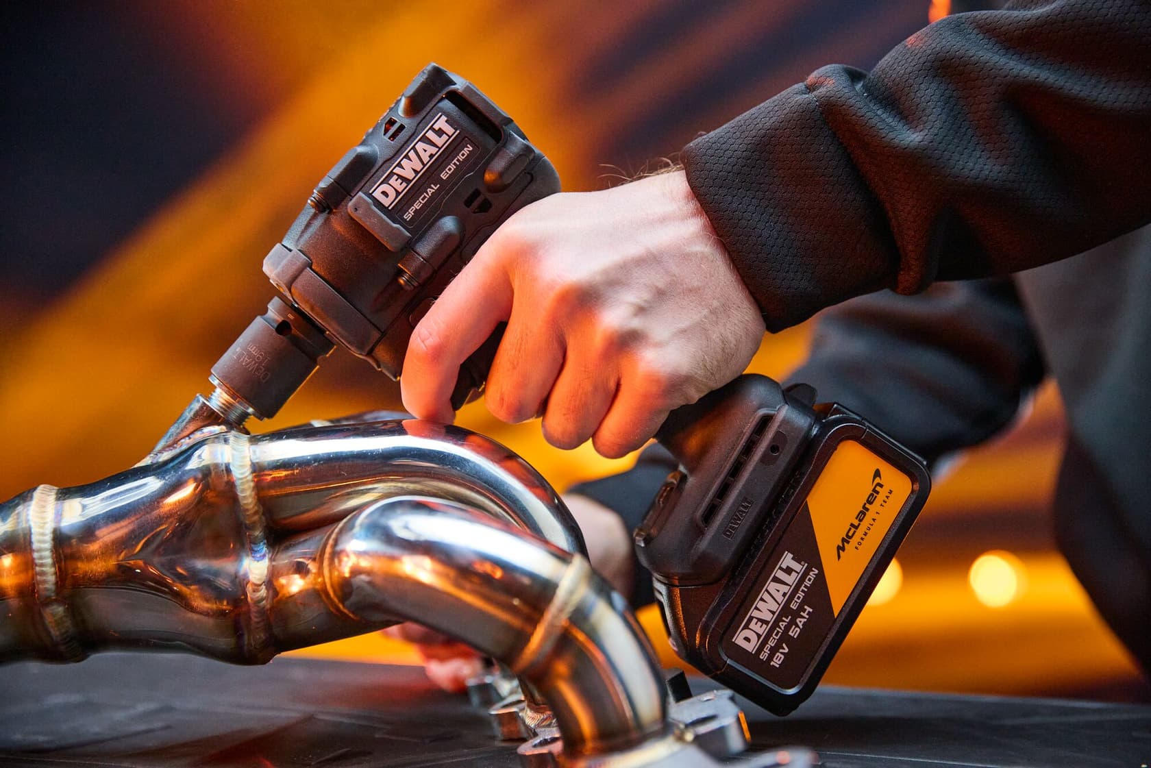 DEWALT x McLaren F1 Team 18V XR Special Edition Compact Impact Wrench with 5Ah battery in application